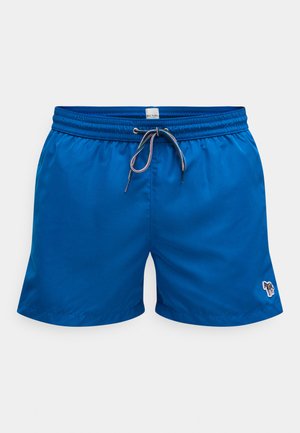 Kék fürdőnadrág elasztikus derékrésszel és zsinórral. Alján jobb oldalon kis hímzett logó található. Sima szövet textúra.