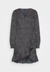 Svart klänning med en omslagsdesign, vita prickar, långa ärmar och en volangsömm. Lätt tyg med en mjuk struktur.