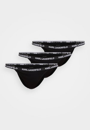 Tre perizoma neri in tessuto morbido. Ognuno presenta una fascia elastica bianca con il marchio "KARL LAGERFELD" ripetuto.