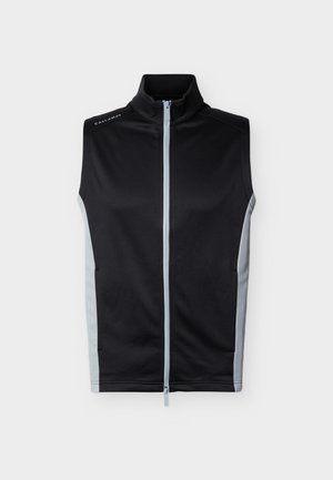 Veste sans manches noire zippée avec des panneaux latéraux gris clair et un col montant, avec la marque "Callaway" sur l'épaule gauche.