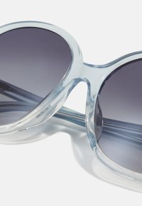 COACH Solbriller - transparent blue gradient