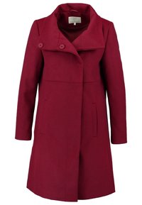 Manteau en mélange de laine bordeaux avec col cranté, deux poches frontales et fermeture à double bouton. Texture lisse et coupe ajustée.