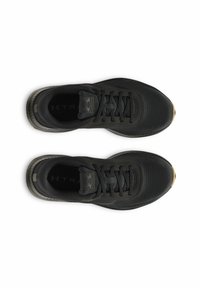 Black athletic shoes with a textured material, round toe, flat laces, and subtle logo detailing on the sides and heel.