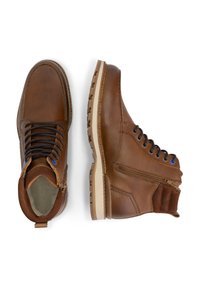 Bruine leren enkelboots met een gestructureerde afwerking, veters, een rits aan de zijkant en een rubberen zool. Accent van blauw bij de veterogen.