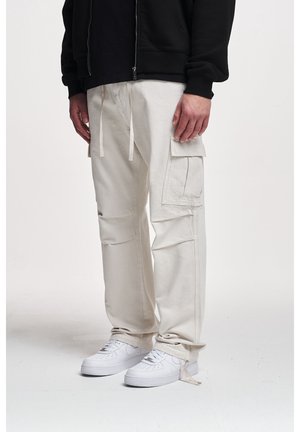 Reisitaskuhousut - sand