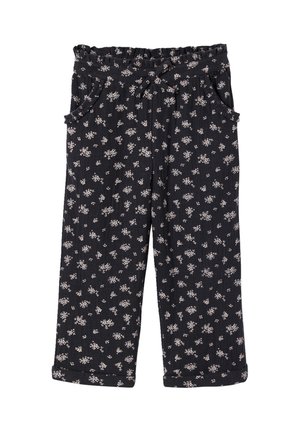 Schwarze, verkürzte Hose mit kleinem weißem Blumenmuster, elastischem Rüschensaum am Bund, seitlichen Taschen und umgeschlagenen Säumen.