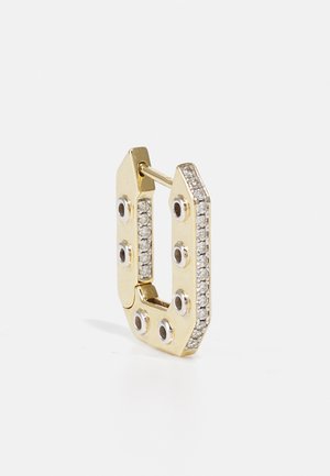 Gold metal hoop earring in U-shape, features a row of clear rhinestones and black embellishments. Smooth texture, polished finish.