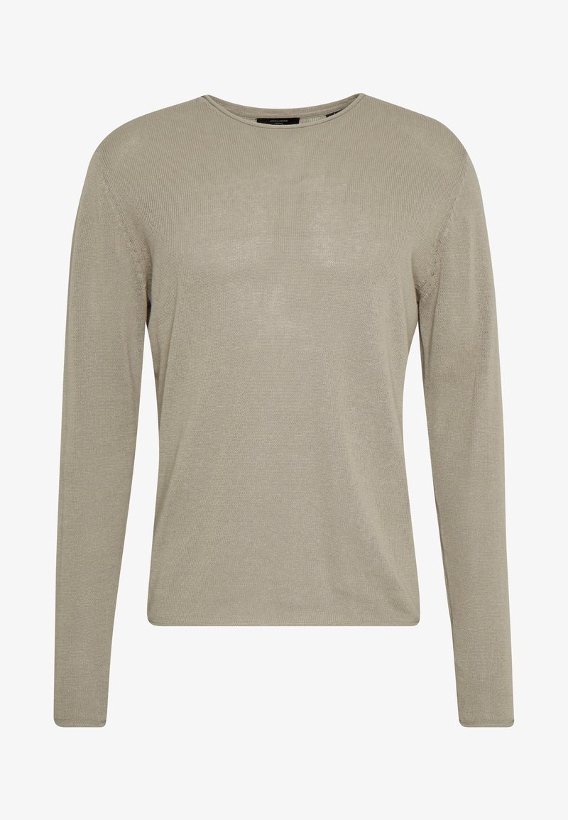 Long-sleeve knit top in light beige, featuring a crew neck, ribbed texture, and subtle sheen throughout the fabric.