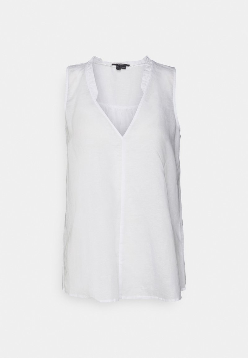 Blouse blanche sans manches avec décolleté en V et détails subtils de volants le long de l'encolure, en tissu léger.