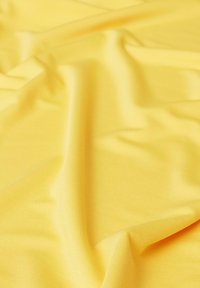 Bright yellow fabric with a smooth texture, featuring subtle horizontal ribbing and draped folds, creating a soft, flowing appearance.