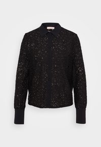 Black crochet shirt with a collar, button closure, and long sleeves. Features openwork patterns and solid fabric cuffs. Textured design.