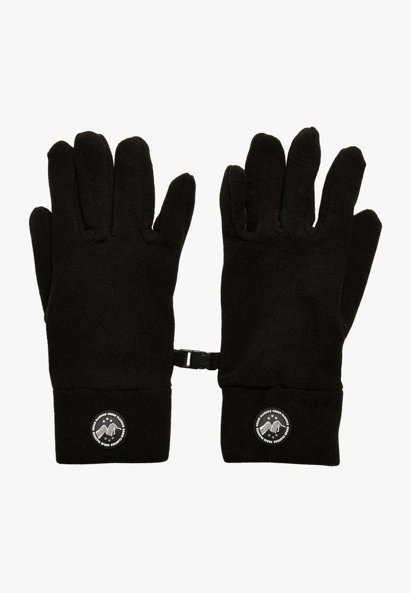 Mustad fleece kinnased, mille varruka ääres on ümmargune logo. Kinnastel on viis sõrme, tekstuuriga kangas ning randmete vahel turvapael.