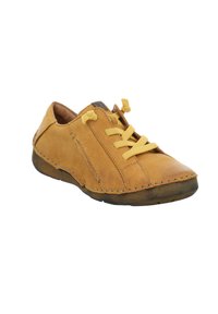 Tan leather shoe with round toe, yellow laces, and visible stitching. Low-profile design with textured rubber sole and side panel detail.