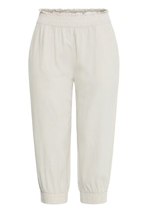 Heledat beežid lühikesed püksid, millel on elastse kogutud vöökohaga ja pahkluuteni ulatuvad mansetid, valmistatud pehmest, kergest kangast.