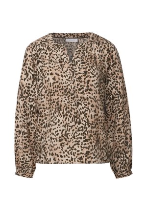 Blouse ample beige avec un motif léopard. Dispose d'un décolleté en V, d'un boutonnage sur le devant, et de manches longues avec des poignets élastiques.