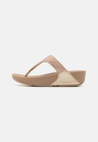 Sandalo infradito beige con una fascia testurizzata che presenta dettagli scintillanti. Materiale morbido e suola leggermente rialzata per un comfort aggiuntivo.