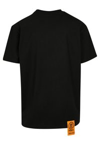 Black cotton t-shirt with a round neck, short sleeves, and a straight cut. Features an orange label at the lower left side.