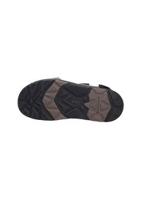 Sandalia deportiva con una suela de goma negra texturizada que presenta una entre suela marrón con un patrón. Diseñada para ofrecer tracción con patrones de relieve angulares.
