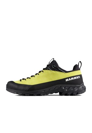 Chaussure de randonnée Mammut basse jaune et noire avec laçage avant, semelle robuste et languette à l'arrière.
