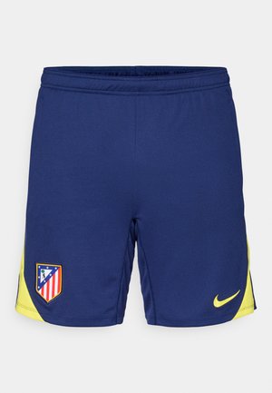 Pantalones cortos deportivos de color azul marino con acentos amarillos, que presentan un parche del logo del equipo y un pequeño swoosh de Nike. Fabricados con tejido transpirable.