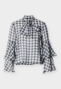 Μπλούζα σε ασπρόμαυρο καρό με ψηλό λαιμό, λεπτομέρεια φιόγκου και μανίκια καμπάνα. Κατασκευασμένη από ελαφρύ, διαφανές ύφασμα με απαλό υφή.
