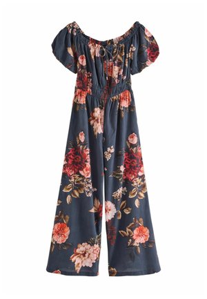 Off-the-shoulder floral jumpsuit in dark blue with an elastic waist. Features large red and pink flowers with green leaves, short puff sleeves.