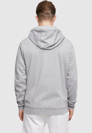 Gray hoodie with a relaxed fit, drawstring hood, and ribbed cuffs and hem. Smooth, soft fabric with a minimalistic design.