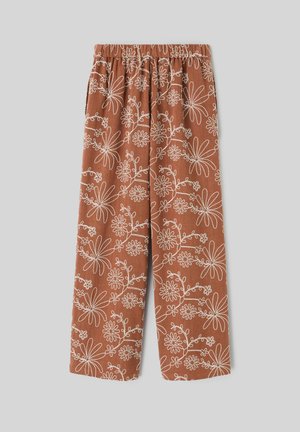 Pantalon marron à jambes larges avec des motifs floraux brodés blancs et une taille élastique sur un fond gris clair.