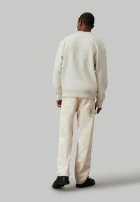 Calvin Klein Jeans MONO APPLIQUE   - Giubbotto Bomber - ivory