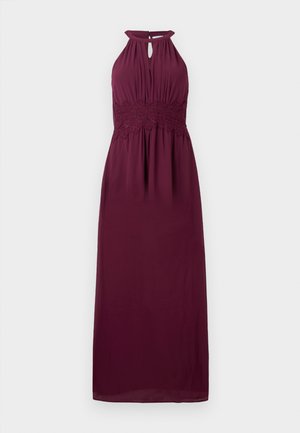 Burgundy maxi dress, halter neck design with keyhole opening, textured lace waistband, flowing fabric, and soft drape.