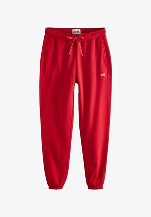 Rdeče športne hlače iz mehkega strukturiranega materiala z elastičnim pasom, vrvico in stranskimi žepi. Na voljo je majhen bel logotip.