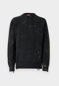 Fekete kötött pulóver kerek nyakkal, bordázott mandzsettákkal és szegéllyel. Kopott textúrájú, világosabb foltokkal. Oldalsó cipzárak a méret szabályozásához.