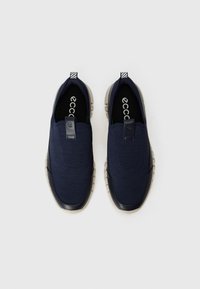 Navy slip-on shoes with a textured fabric upper, featuring a contrasting gray sole and a small loop tab for easy wearing.