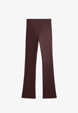 Brune flagrende bukser med en glat tekstur, høj talje og et minimalistisk design. Stoffet ser strækbart ud og er velegnet til afslappet brug.