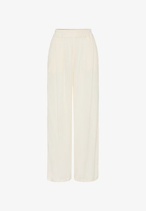 Pantaloni larghi leggeri di colore crema con elastico in vita. Realizzati in tessuto morbido e fluido. Presentano delle pieghe per un tocco di texture in più.