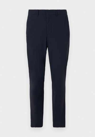 Tamsiai mėlynos pritaikytos kelnės, pagamintos iš audinio, turi plokščią priekį, diržo kilpas ir liekną kirpimą su šoniniais kišenėmis.