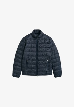 Marineblaue, leichte Steppjacke mit Stehkragen, gestepptem Design, Frontreißverschluss und zwei seitlichen Reißverschlusstaschen.