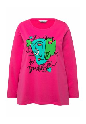 T-shirt à manches longues de couleur rose, présentant une illustration ludique de deux visages en vert et bleu avec le texte "Dormir pour rêver" en noir.