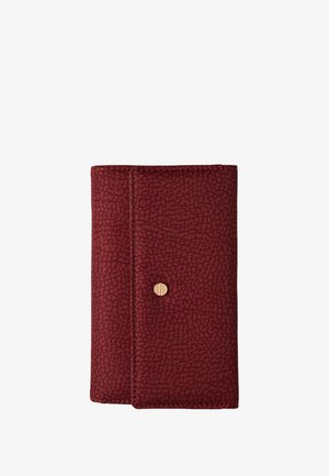Burgundy wallet with a textured pattern, gold snap closure, and contrasting stitching. Compact rectangular shape.