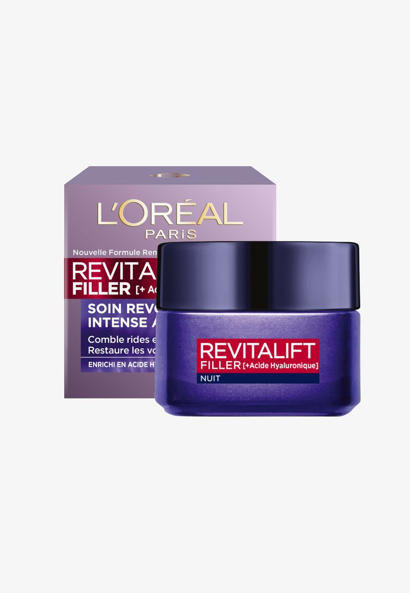 Crème de nuit Revitalift Filler dans un pot violet, présentant une texture lisse et une étiquette claire avec des accents rouges sur une boîte violette.