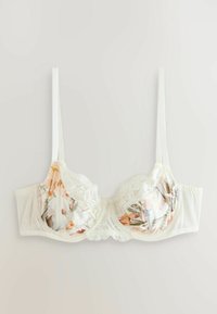 Sutien alb cu armături, cu model floral și detalii din dantelă, prevăzut cu bretele reglabile și un panou central din dantelă cu margini ondulate.