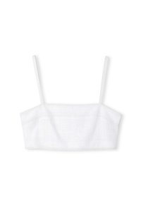 Top de tanque blanco recortado con tirantes finos. Presenta un tejido texturizado y costuras decorativas a lo largo de los bordes. Diseño simple y minimalista.