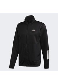 Veste zippée noire Adidas avec col montant, logo Adidas blanc sur la poitrine et trois bandes blanches sur le bas des manches.