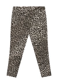 Leggings en imprimé léopard avec une taille élastique, présentant des taches noires et brunes sur un fond beige clair, texture lisse, coupe ajustée.
