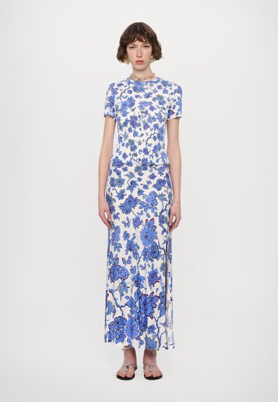 Floral-patterned blue and white top and maxi skirt; smooth fabric with a slight sheen, short sleeves, and side slit in the skirt.