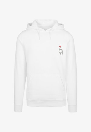 Bela bombažna kapuca s sprednjim žepom in kapuco s vrvico. Vsebuje majhno grafiko roke, ki izvaja gesto z rdečim srcem.