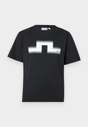T-shirt noir à manches courtes avec un logo géométrique blanc et le texte "J.LINDEBERG" sur la poitrine et l'étiquette du col.