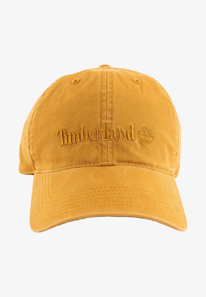 Gorra de béisbol de algodón amarillo con el logotipo bordado de "Timberland" y un emblema de árbol. Textura suave con visera curvada y correa trasera ajustable.