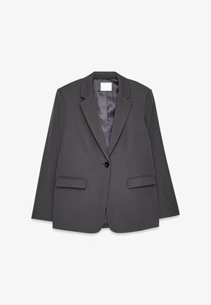 Blazer gris en tissu lisse, avec col à revers, fermeture à un bouton, deux poches avant et doublure intérieure douce.