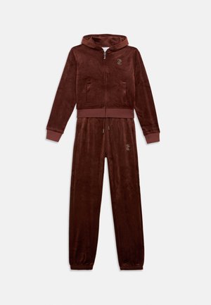 Brown velour tracksuit featuring a zip-up hoodie with front pockets and matching pants with elastic cuffs and adjustable drawstring waist.